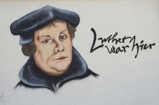 A drawn mural of Martin Luther. The words "Luther war hier" appears to the side.
